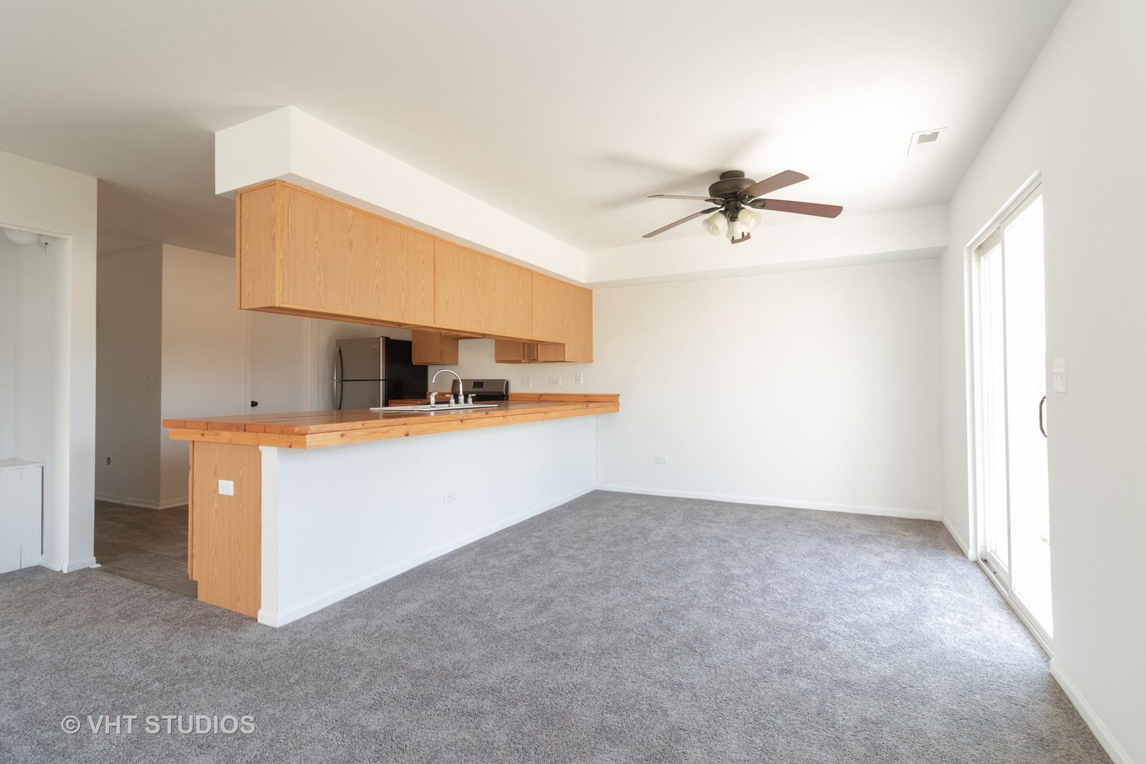 25188 Faraday Road Manhattan, IL 60442 - Photo 6 of 10 a view of a kitchen with a sink and a chandelier fan