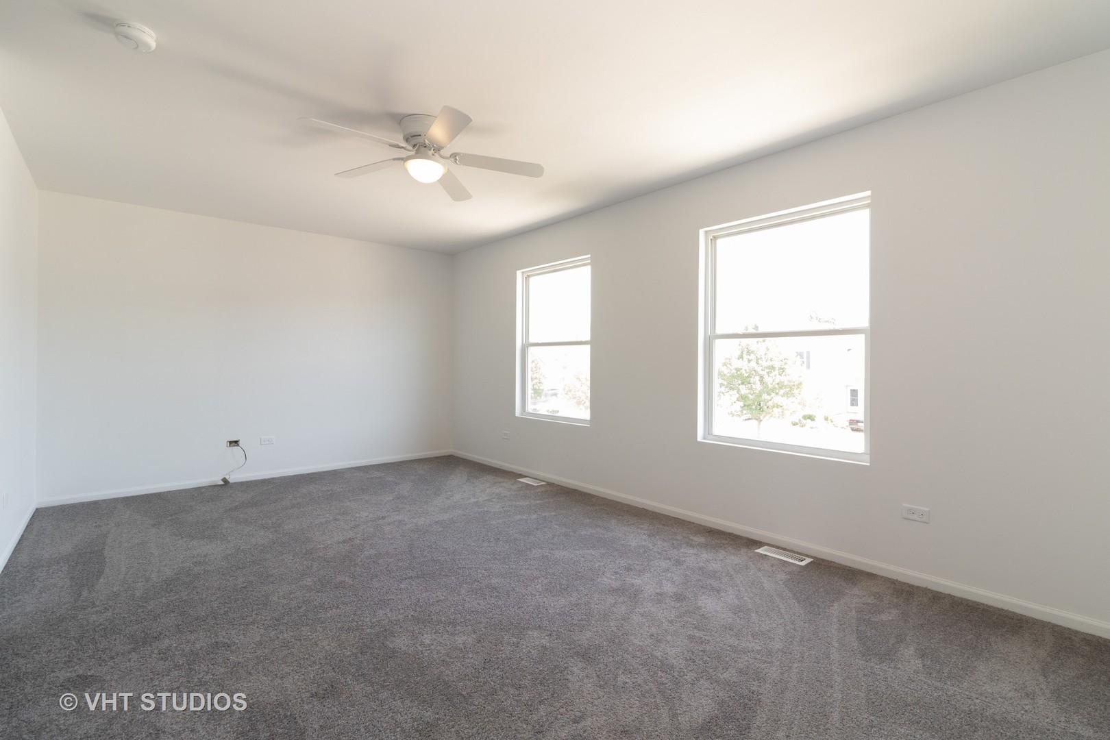 25188 Faraday Road Manhattan, IL 60442 - Photo 7 of 10 an empty room with a window and a fan