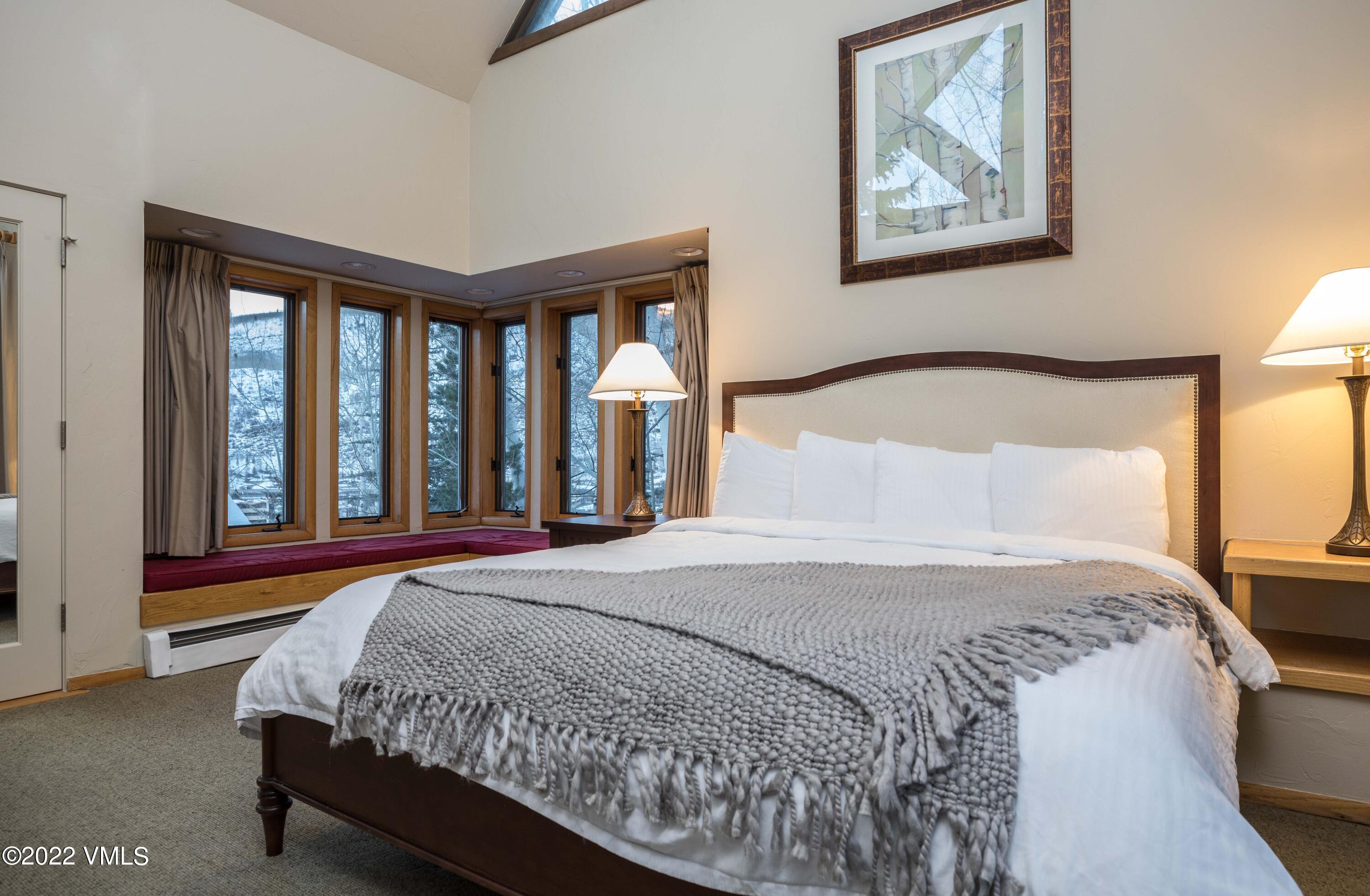 224 West Forest Road Vail, CO 81657 - Photo 6 of 12 a bedroom with a large bed and a window