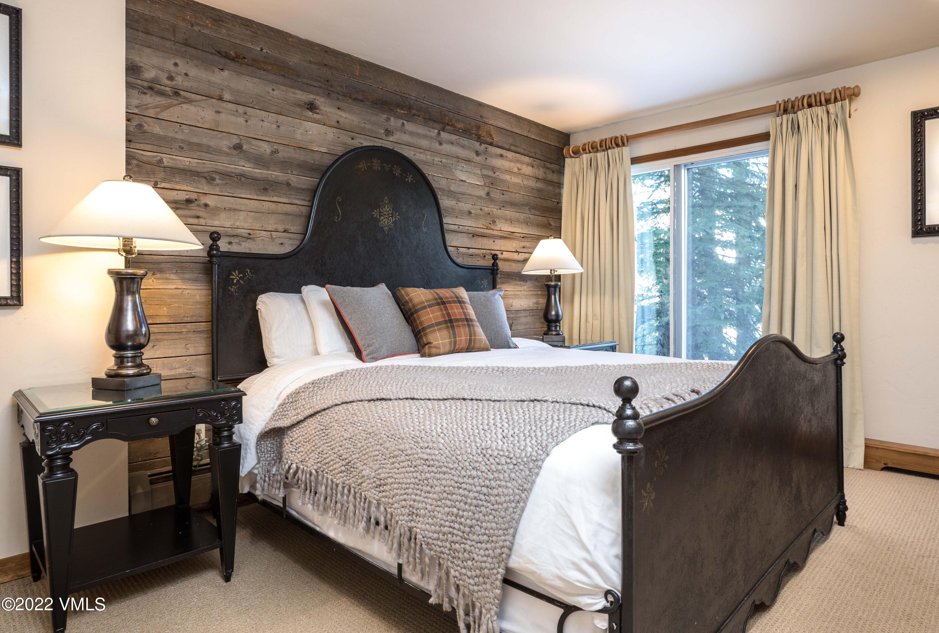 224 West Forest Road Vail, CO 81657 - Photo 8 of 12 a bed room with a bed and a window