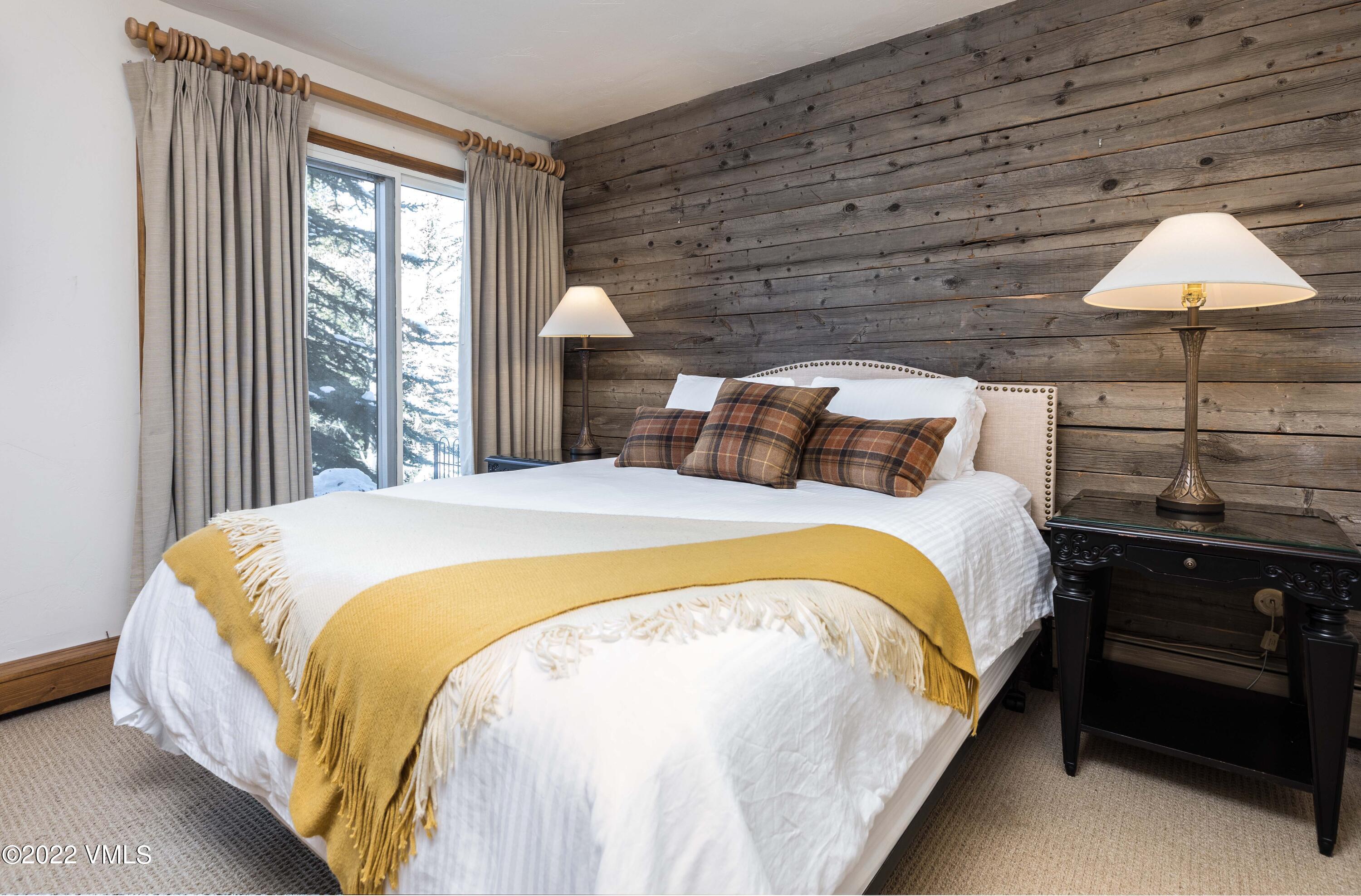 224 West Forest Road Vail, CO 81657 - Photo 10 of 12 a bed sitting in a bedroom next to a window
