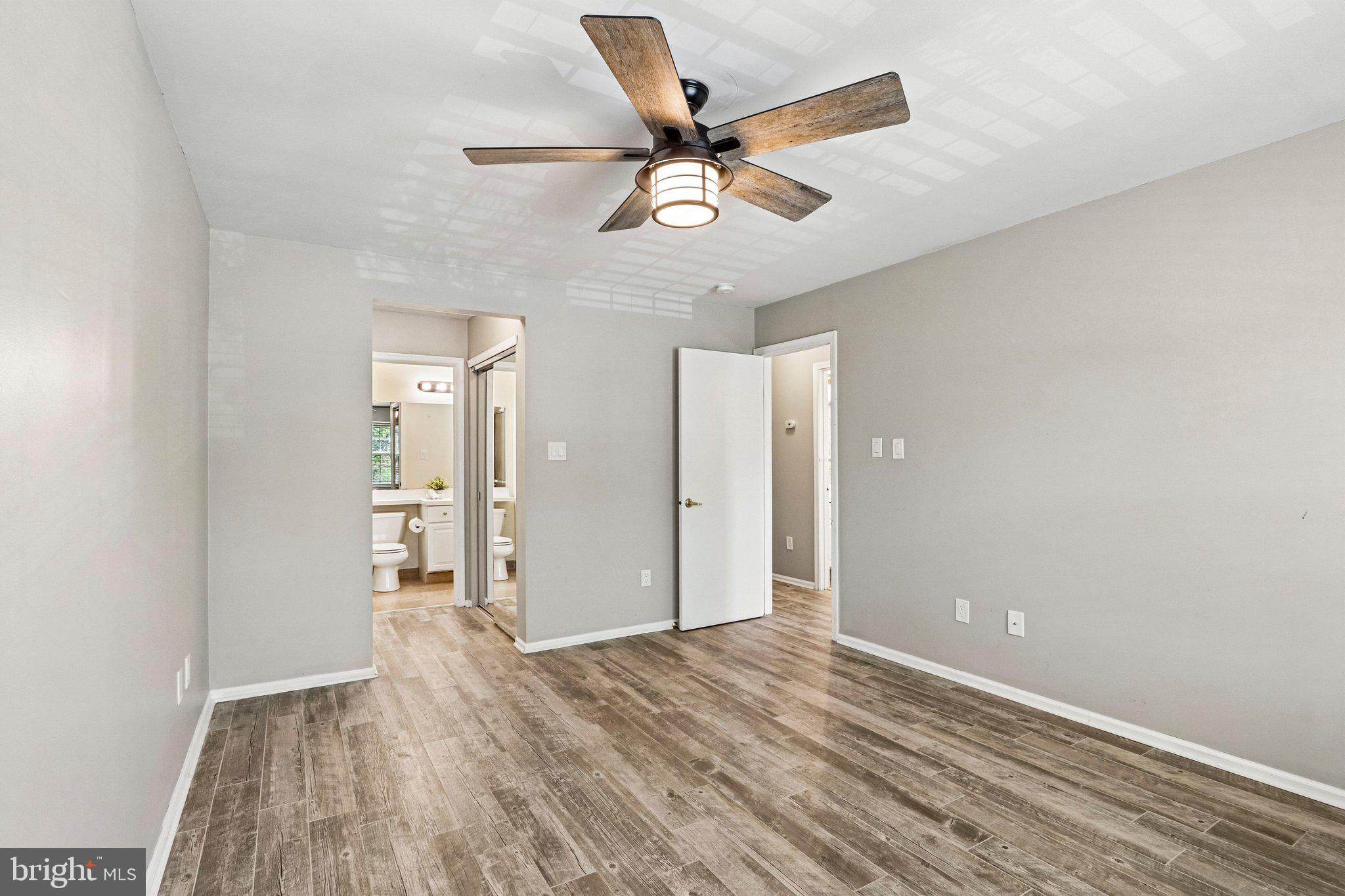 803 Wharton Road Mount Laurel, NJ 08054 - Photo 23 of 48 wooden floor in an empty room with a window