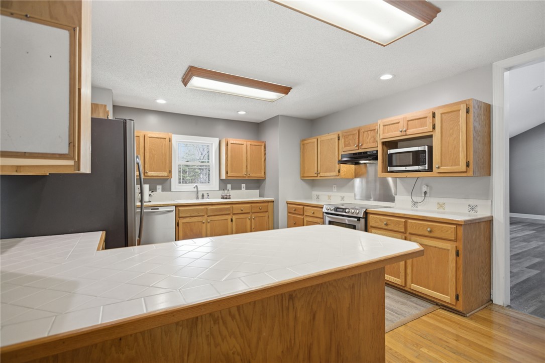 196 Flyroot Trail Pickens, SC 29671 - Photo 12 of 48 This spacious kitchen offers ample cabinetry and counter space, perfect for culinary endeavors.