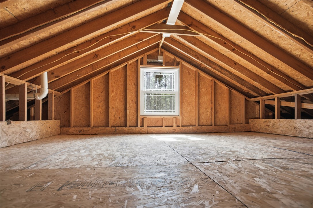 196 Flyroot Trail Pickens, SC 29671 - Photo 32 of 48 This spacious attic with exposed beams offers abundant potential for future customization.