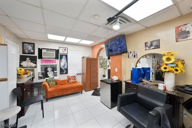 a bedroom with furniture and wooden floor