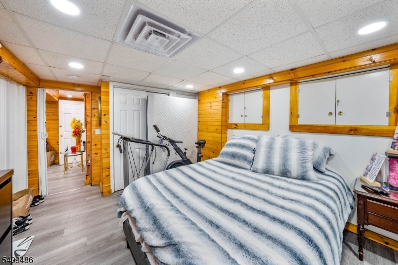 376 Elmora Avenue, Unit 378 Elizabeth, NJ 07208 - Photo 21 of 49 a bedroom with a bed and wooden floor