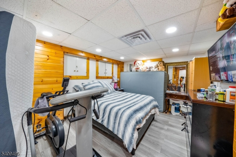 376 Elmora Avenue, Unit 378 Elizabeth, NJ 07208 - Photo 22 of 49 a bed room with two bed and a large window