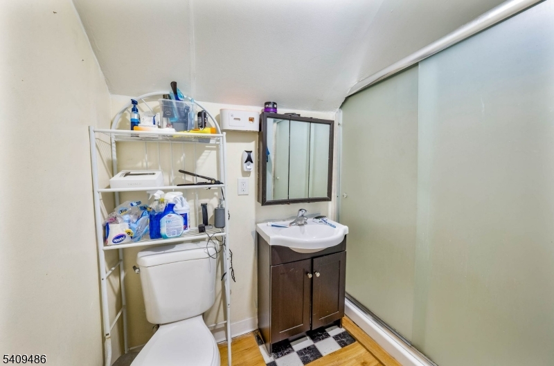 376 Elmora Avenue, Unit 378 Elizabeth, NJ 07208 - Photo 24 of 49 a bathroom with a sink a toilet and a mirror