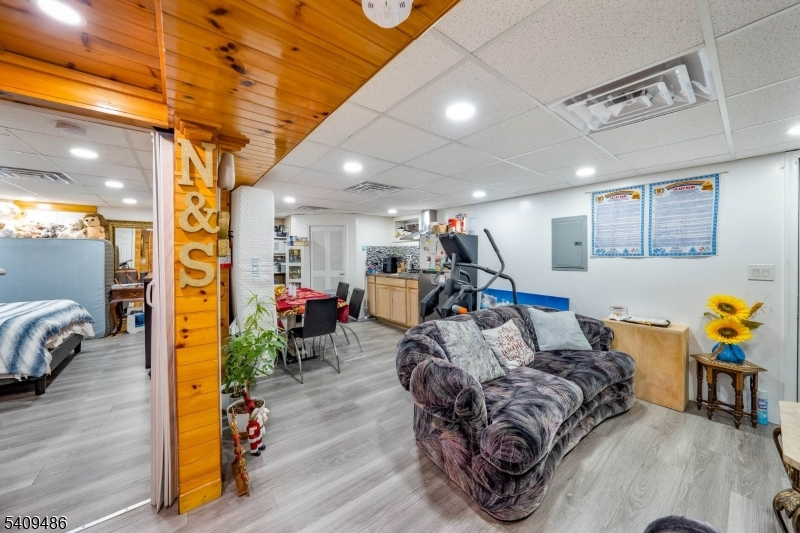 376 Elmora Avenue, Unit 378 Elizabeth, NJ 07208 - Photo 26 of 49 a living room with furniture and wooden floor