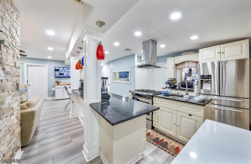 376 Elmora Avenue, Unit 378 Elizabeth, NJ 07208 - Photo 28 of 49 a kitchen with stainless steel appliances granite countertop a sink refrigerator and cabinets