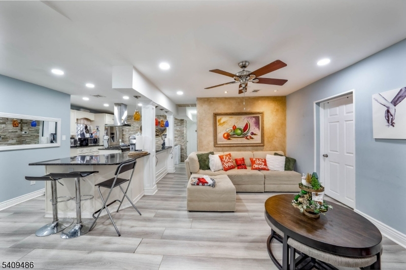 376 Elmora Avenue, Unit 378 Elizabeth, NJ 07208 - Photo 29 of 49 a living room with furniture and kitchen view