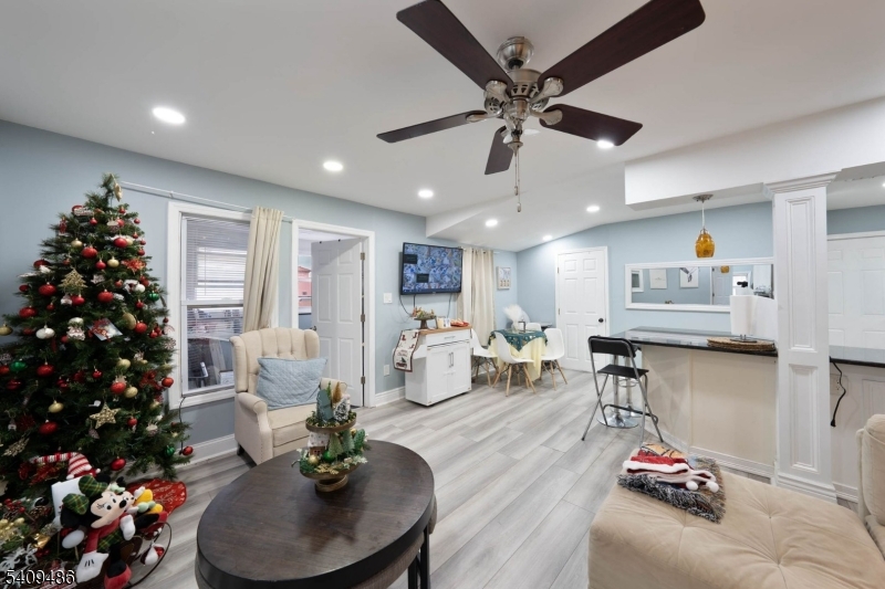 376 Elmora Avenue, Unit 378 Elizabeth, NJ 07208 - Photo 30 of 49 a living room with furniture and flowers