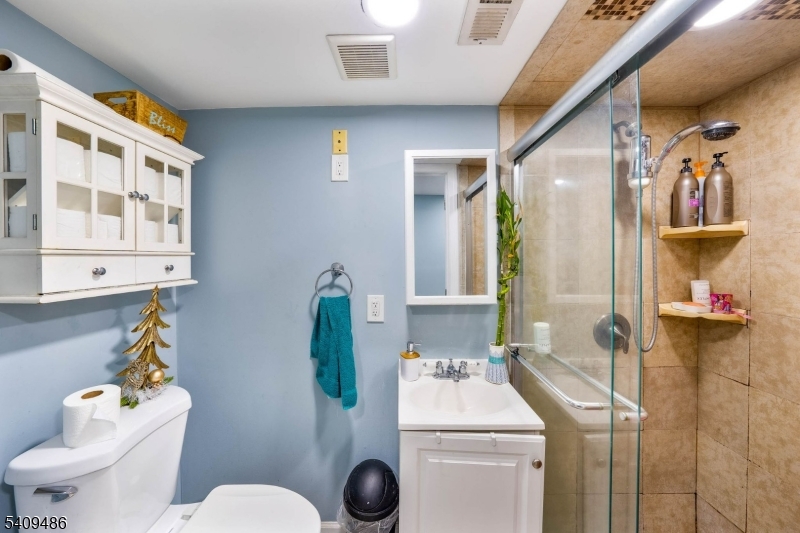 376 Elmora Avenue, Unit 378 Elizabeth, NJ 07208 - Photo 33 of 49 a bathroom with a sink toilet and shower