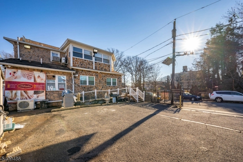 376 Elmora Avenue, Unit 378 Elizabeth, NJ 07208 - Photo 4 of 49 a view of a street with cars