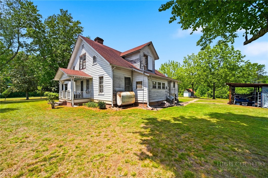3450 Sparta Road North Wilkesboro, NC 28659 - Photo 27 of 34 a front view of a house with swimming pool having outdoor seating