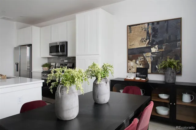 a dining table with potted plant