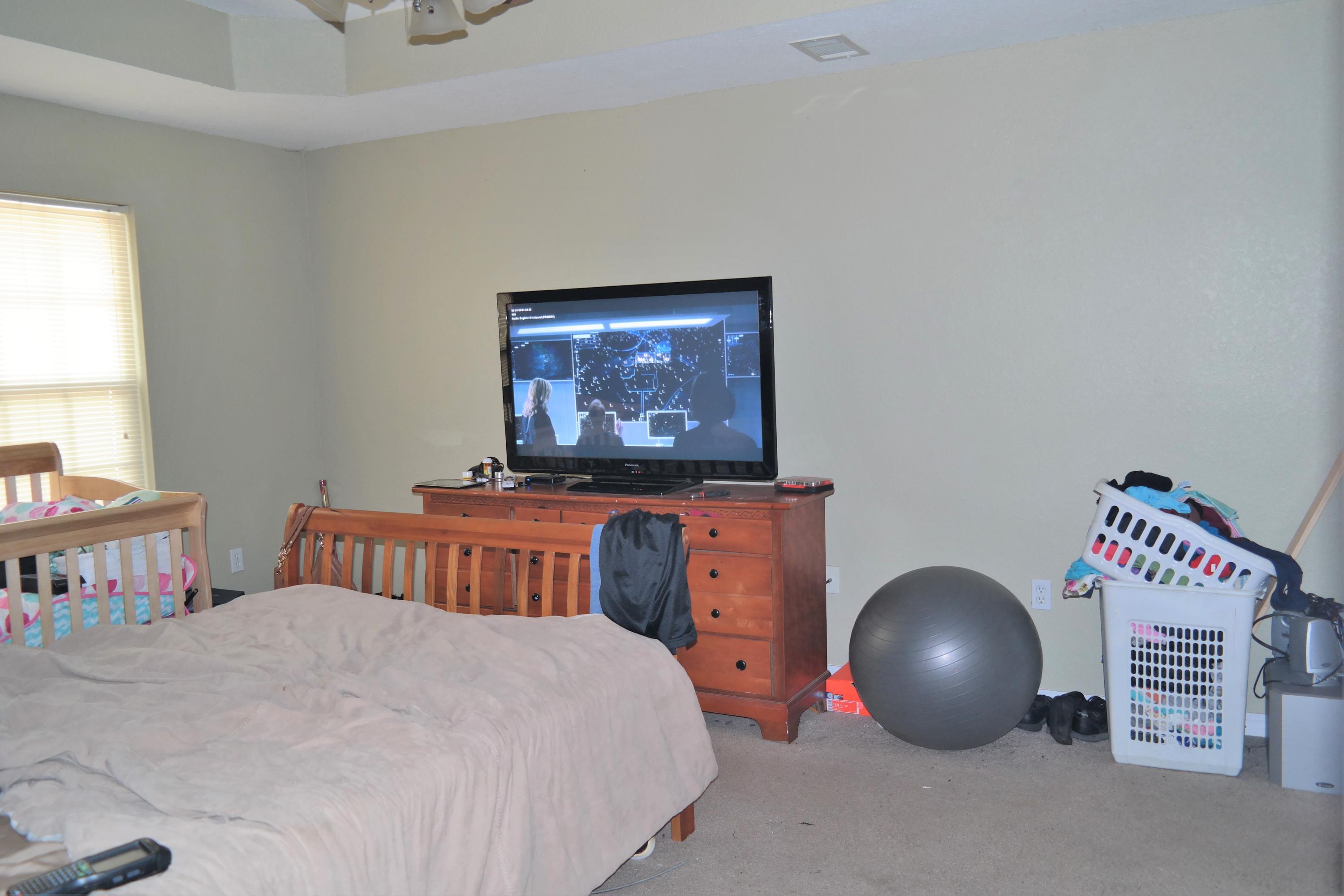 130 Crocus Avenue DeFuniak Springs, FL 32433 - Photo 11 of 24 a bedroom with furniture and a baby crib