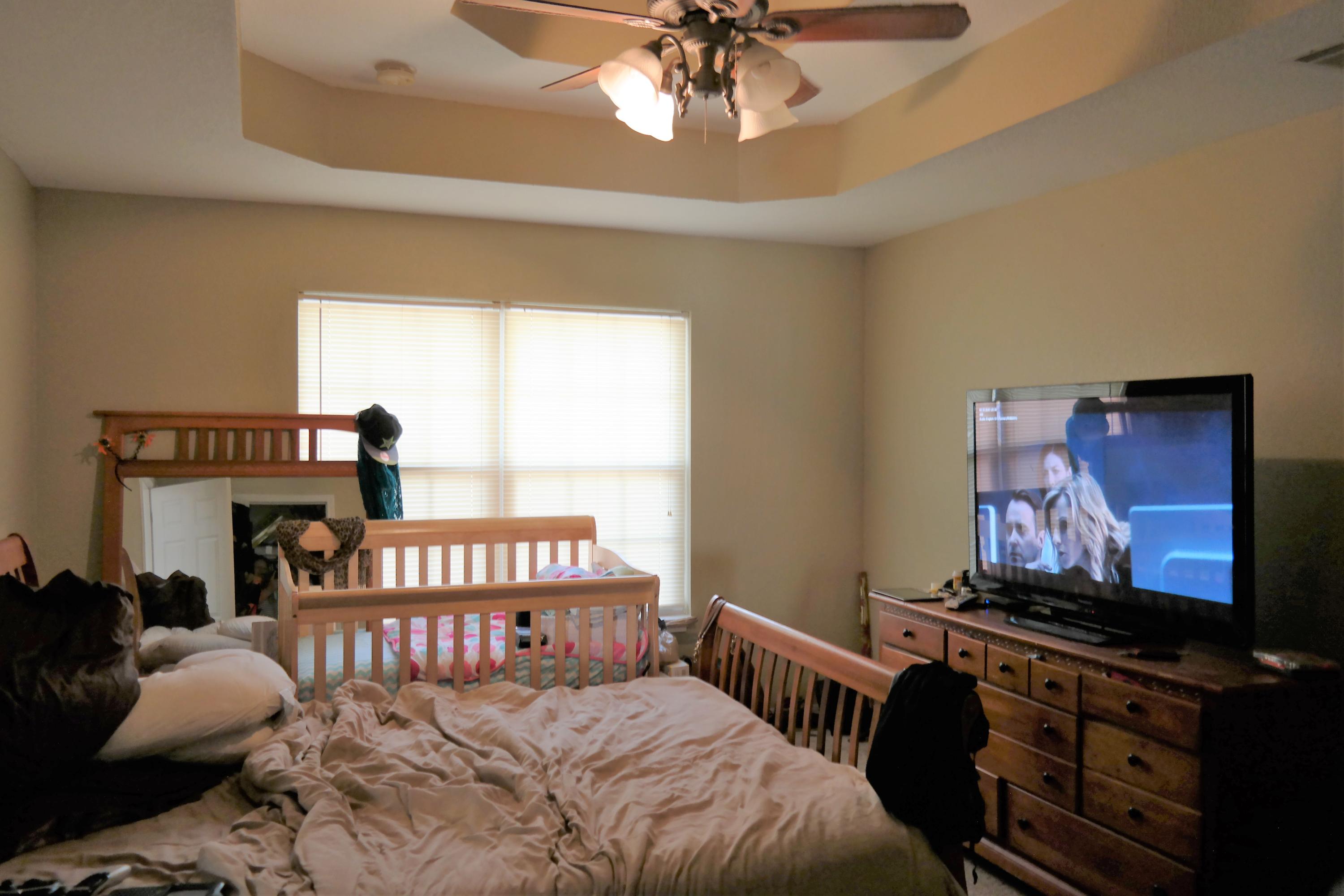 130 Crocus Avenue DeFuniak Springs, FL 32433 - Photo 12 of 24 a bedroom with a bed and a flat screen tv