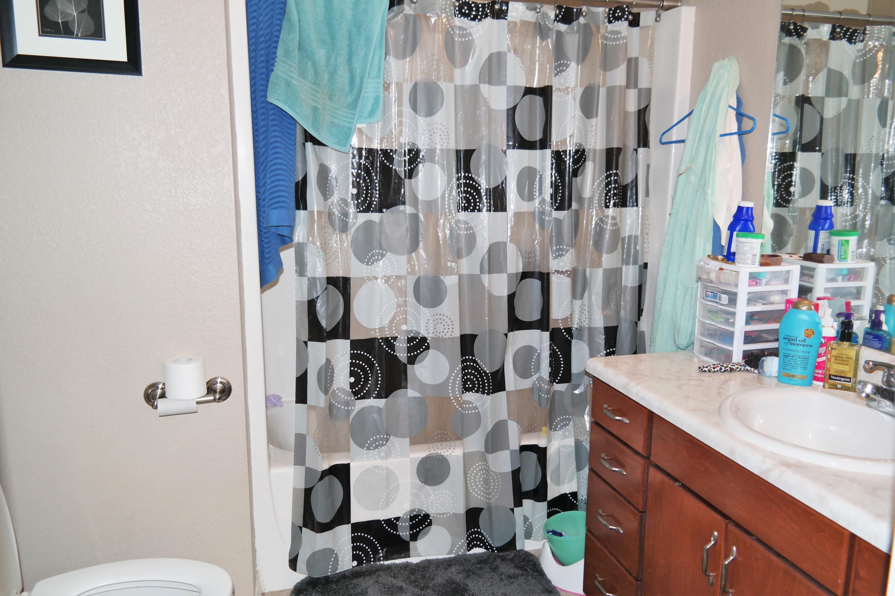 130 Crocus Avenue DeFuniak Springs, FL 32433 - Photo 13 of 24 a bathroom with a sink toilet and shower