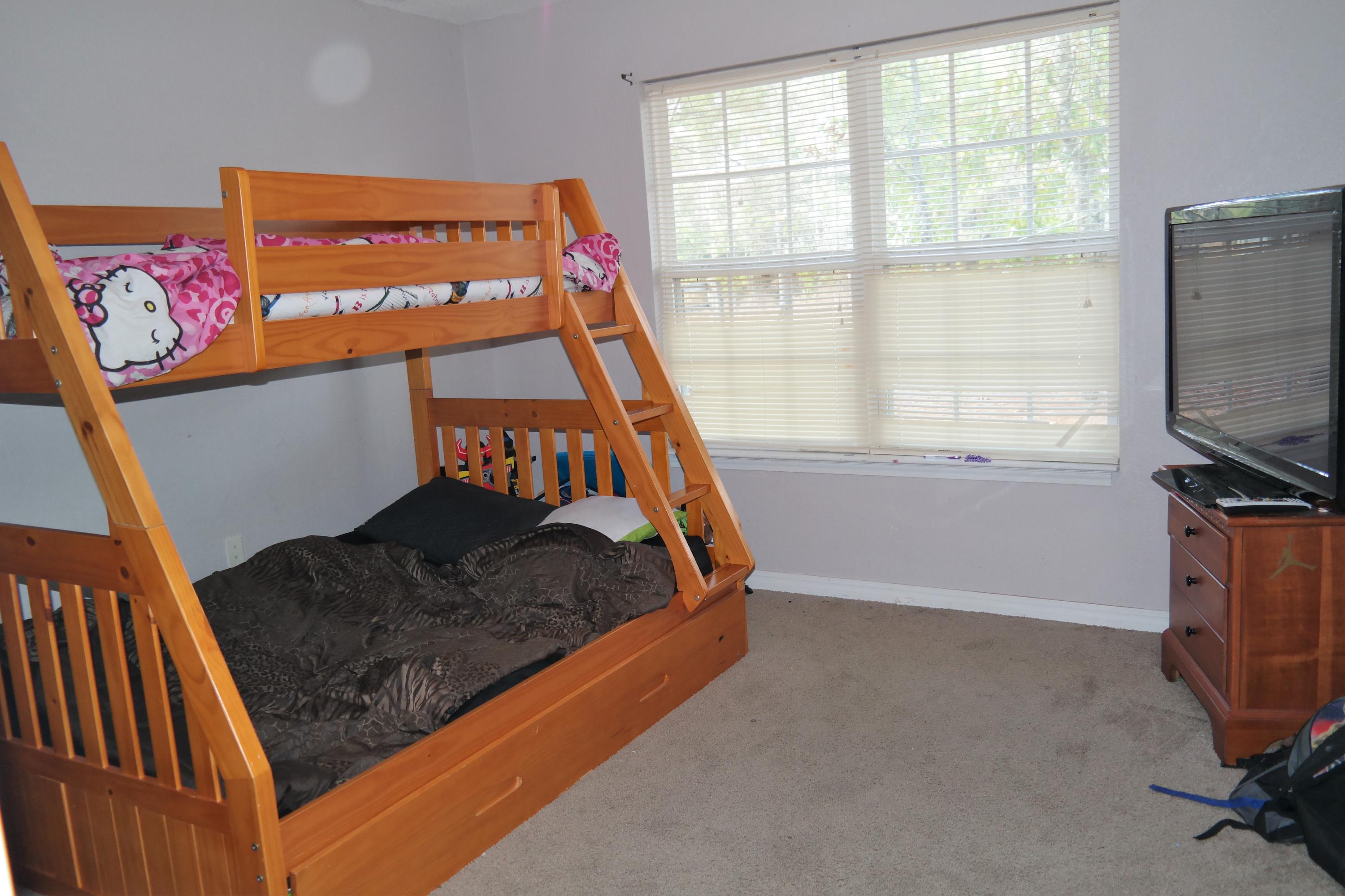 130 Crocus Avenue DeFuniak Springs, FL 32433 - Photo 14 of 24 a bedroom with furniture and a window