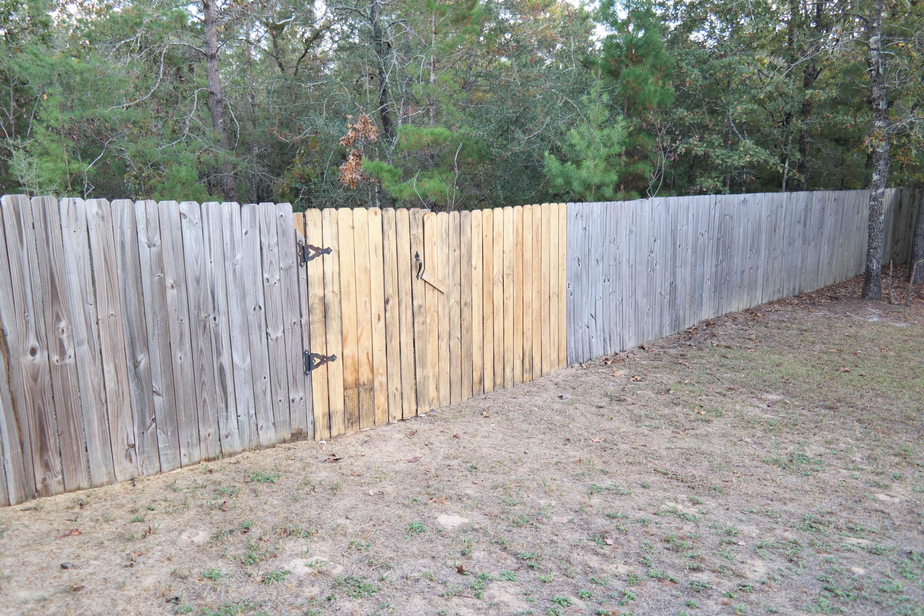 130 Crocus Avenue DeFuniak Springs, FL 32433 - Photo 20 of 24 a view of a backyard with wooden fence