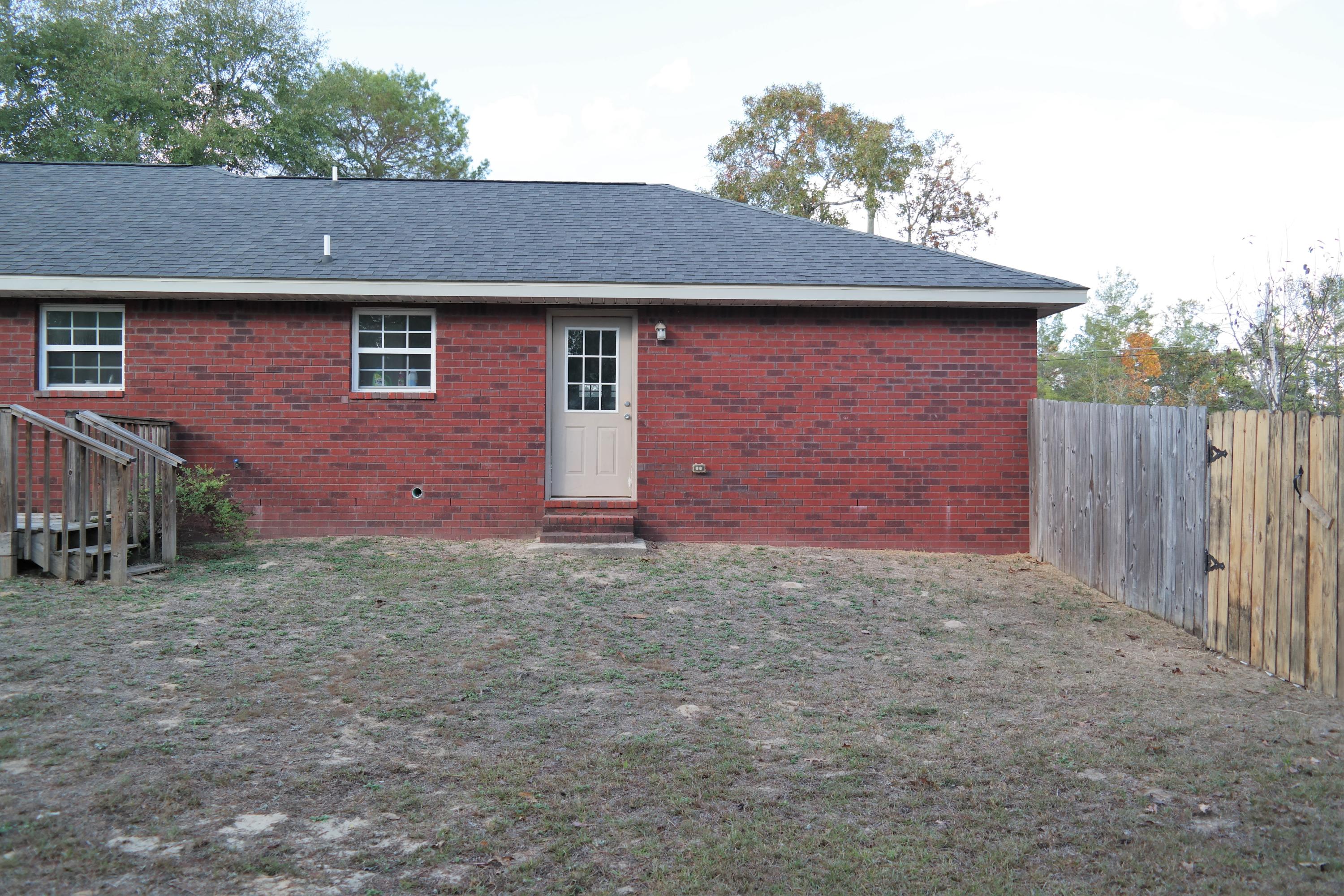 130 Crocus Avenue DeFuniak Springs, FL 32433 - Photo 21 of 24 a front view of a house with a yard