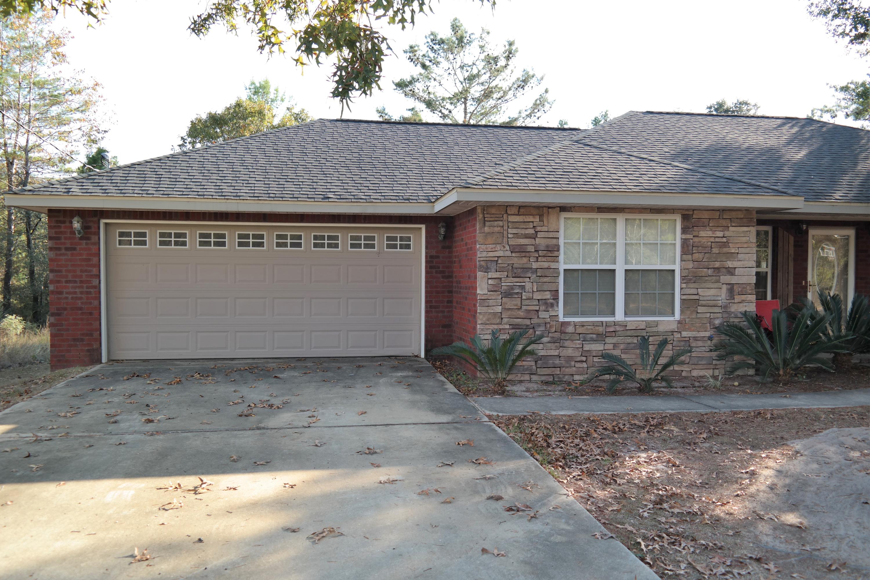 130 Crocus Avenue DeFuniak Springs, FL 32433 - Photo 22 of 24 a front view of a house with a yard