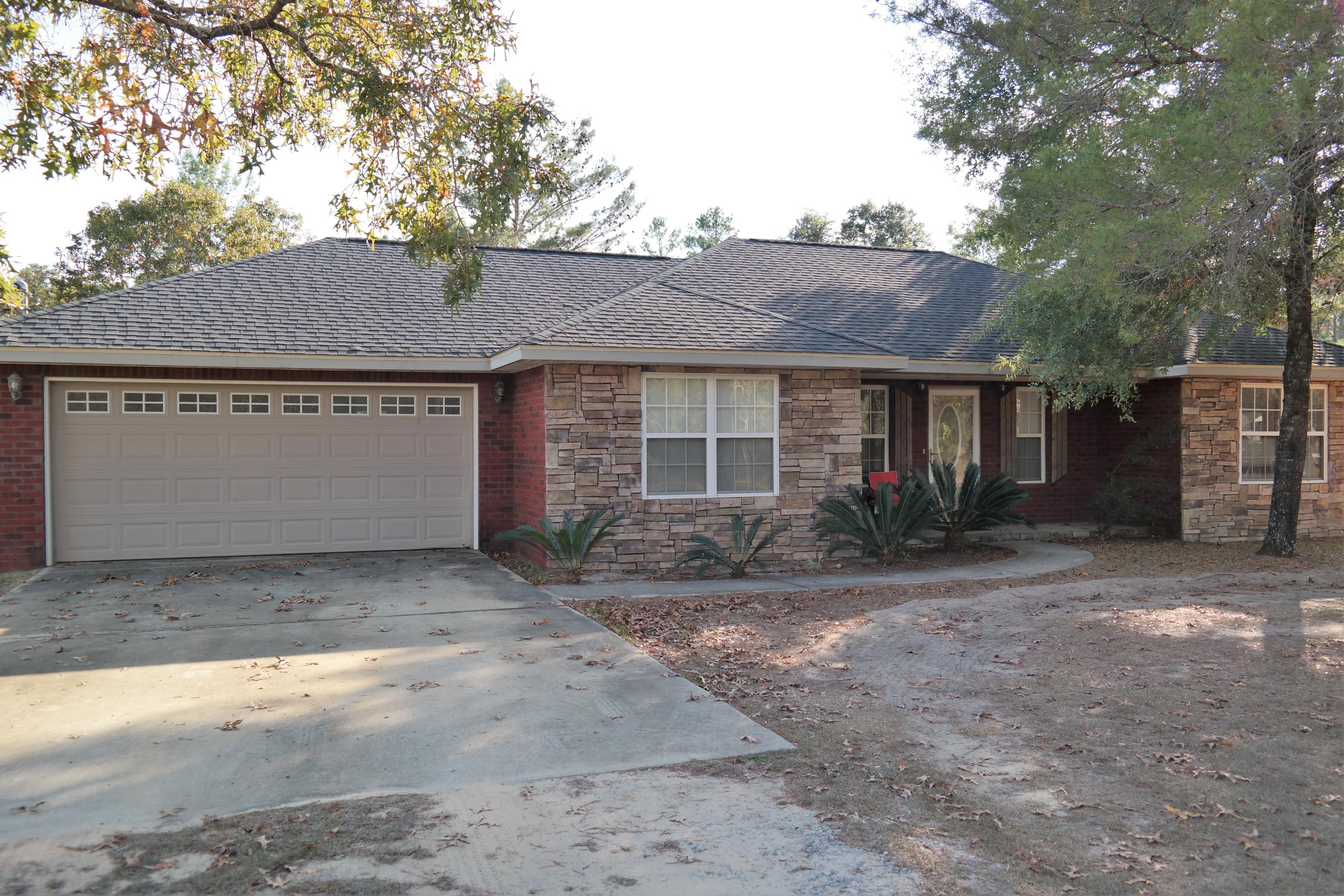 130 Crocus Avenue DeFuniak Springs, FL 32433 - Photo 23 of 24 a view of a house with a yard