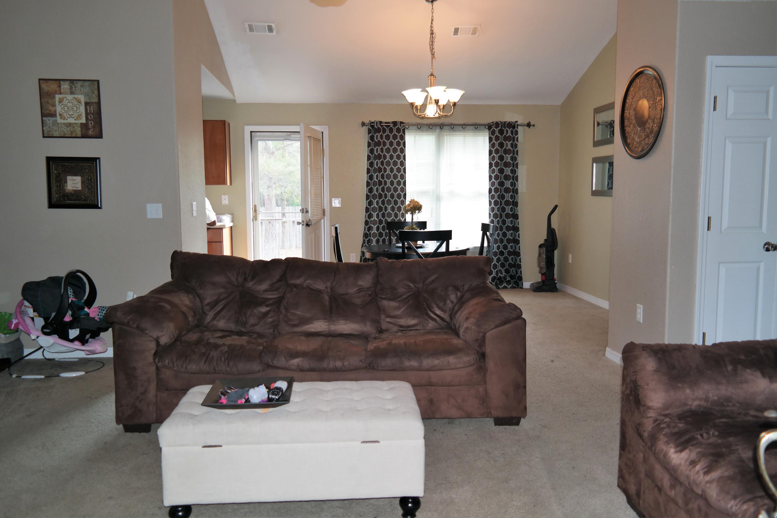 130 Crocus Avenue DeFuniak Springs, FL 32433 - Photo 4 of 24 a living room with furniture and a chandelier