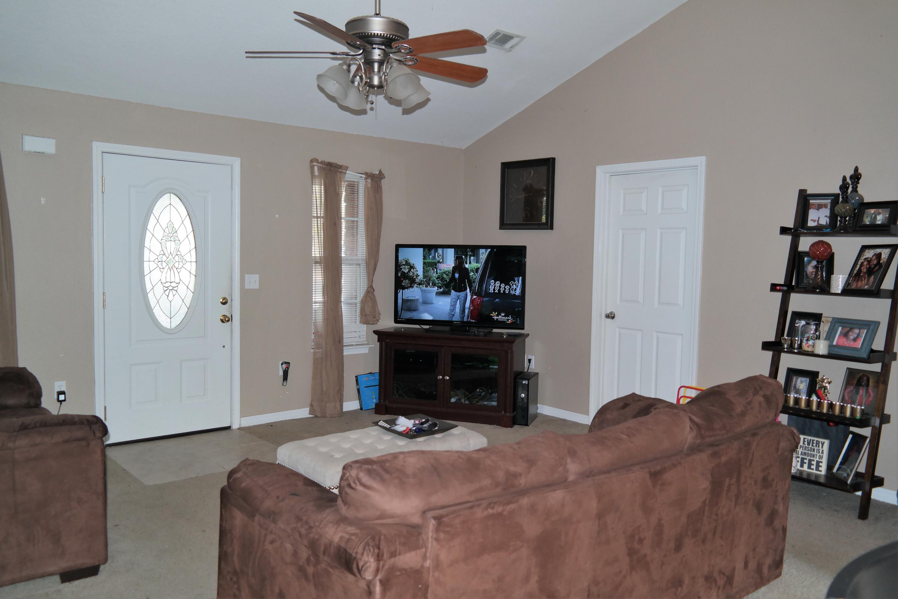 130 Crocus Avenue DeFuniak Springs, FL 32433 - Photo 5 of 24 a living room with furniture and a flat screen tv