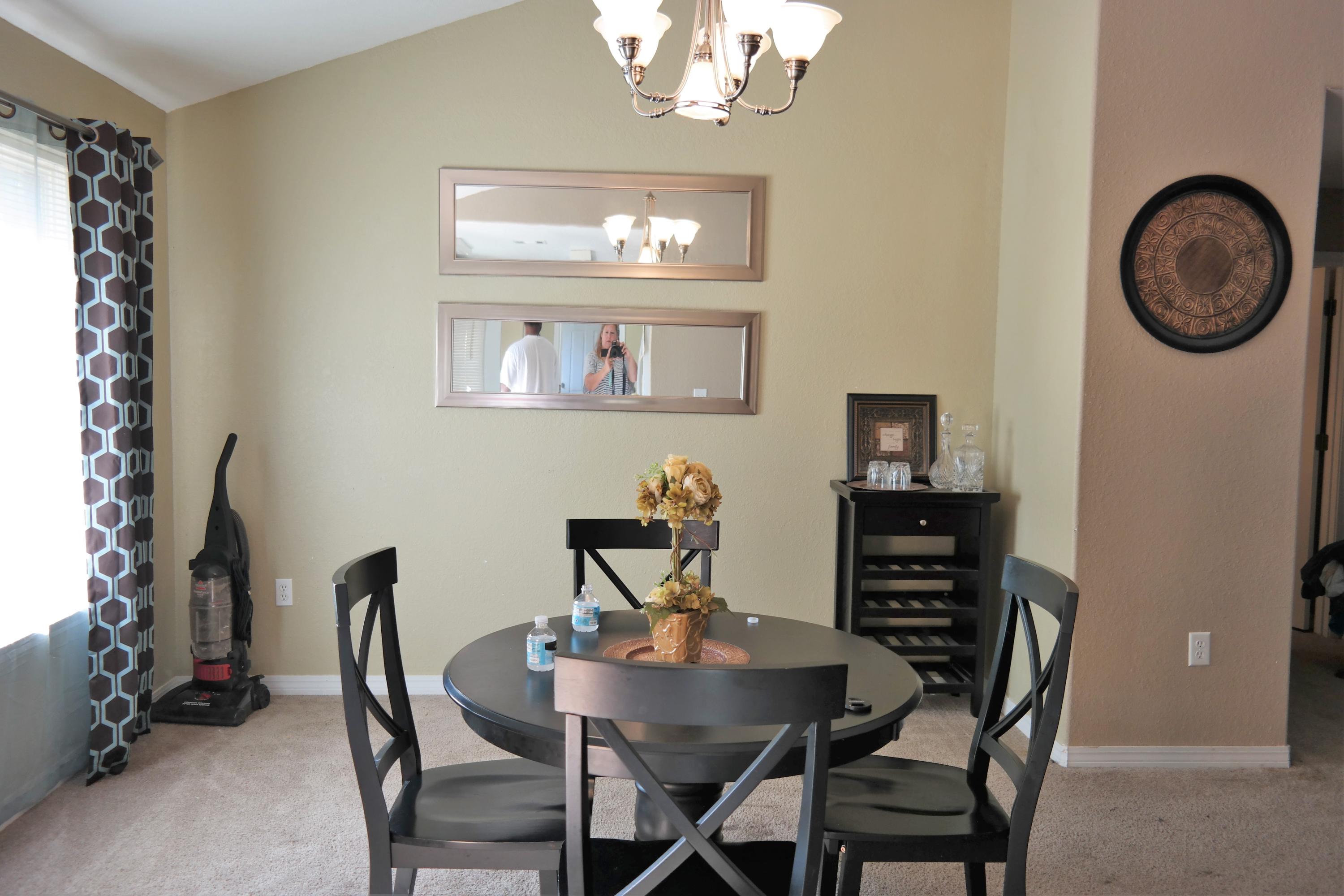 130 Crocus Avenue DeFuniak Springs, FL 32433 - Photo 6 of 24 a view of a dining room with furniture and chandelier
