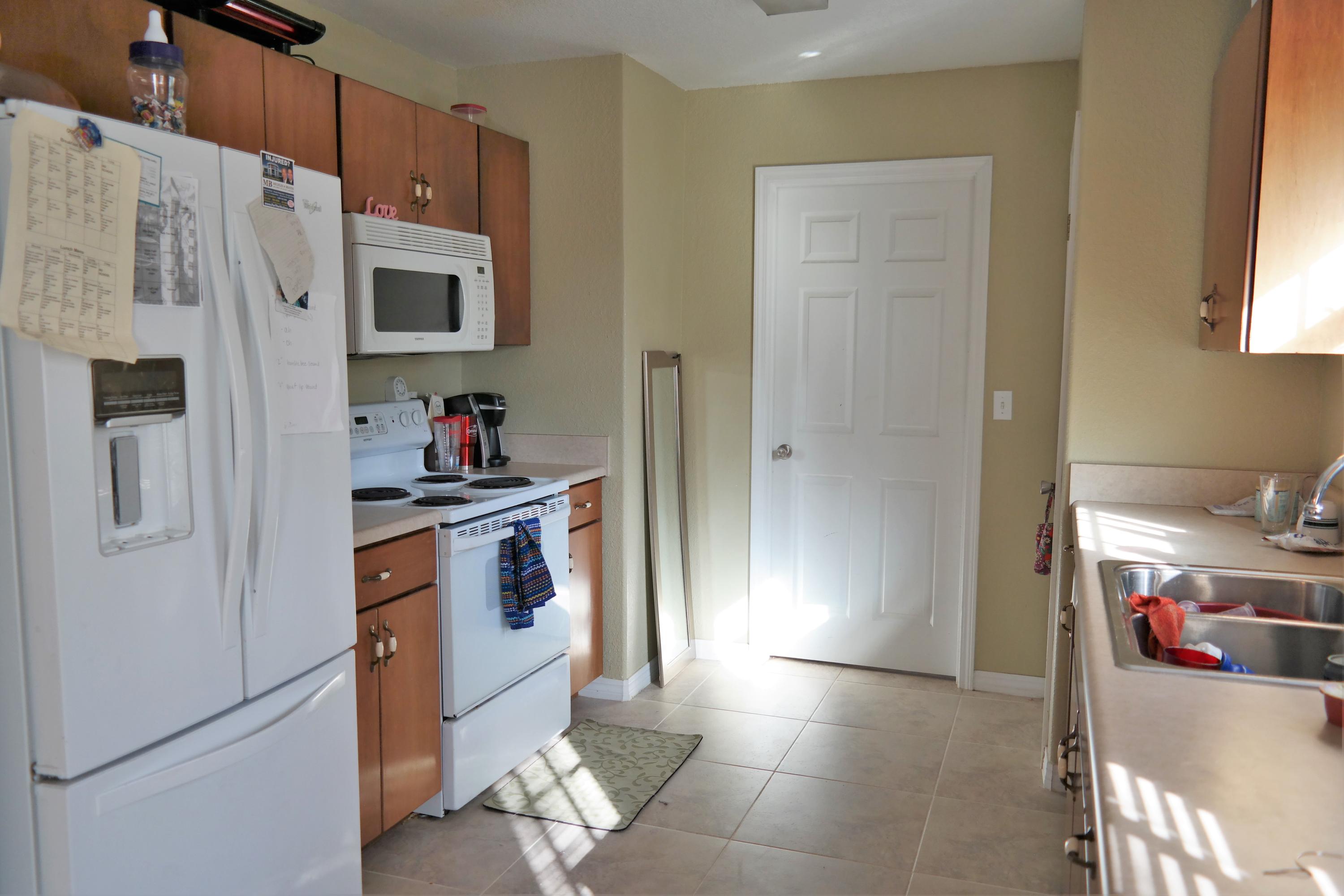 130 Crocus Avenue DeFuniak Springs, FL 32433 - Photo 8 of 24 a kitchen with stainless steel appliances a refrigerator and a stove
