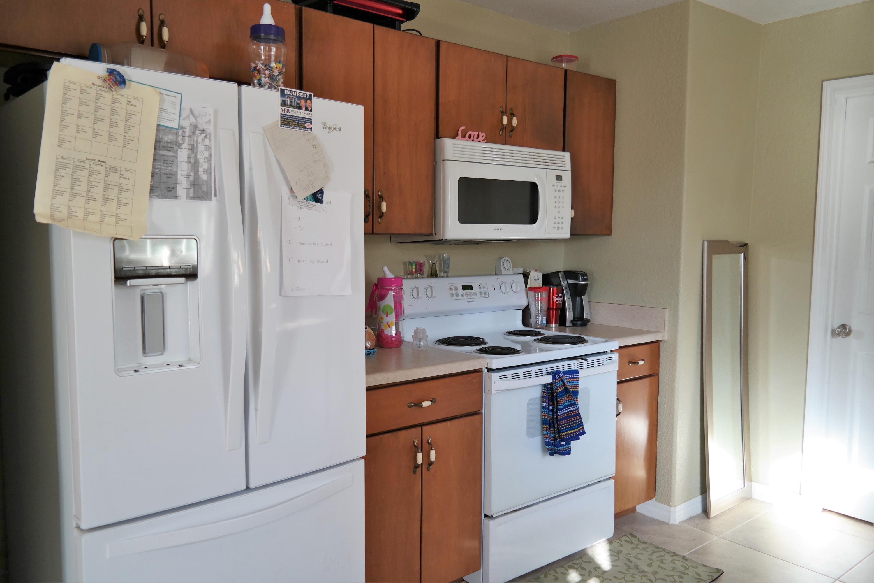 130 Crocus Avenue DeFuniak Springs, FL 32433 - Photo 9 of 24 a kitchen with stainless steel appliances granite countertop a refrigerator and a stove