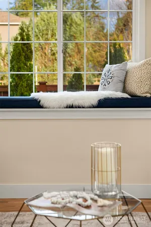 a view of a couch in front of a window