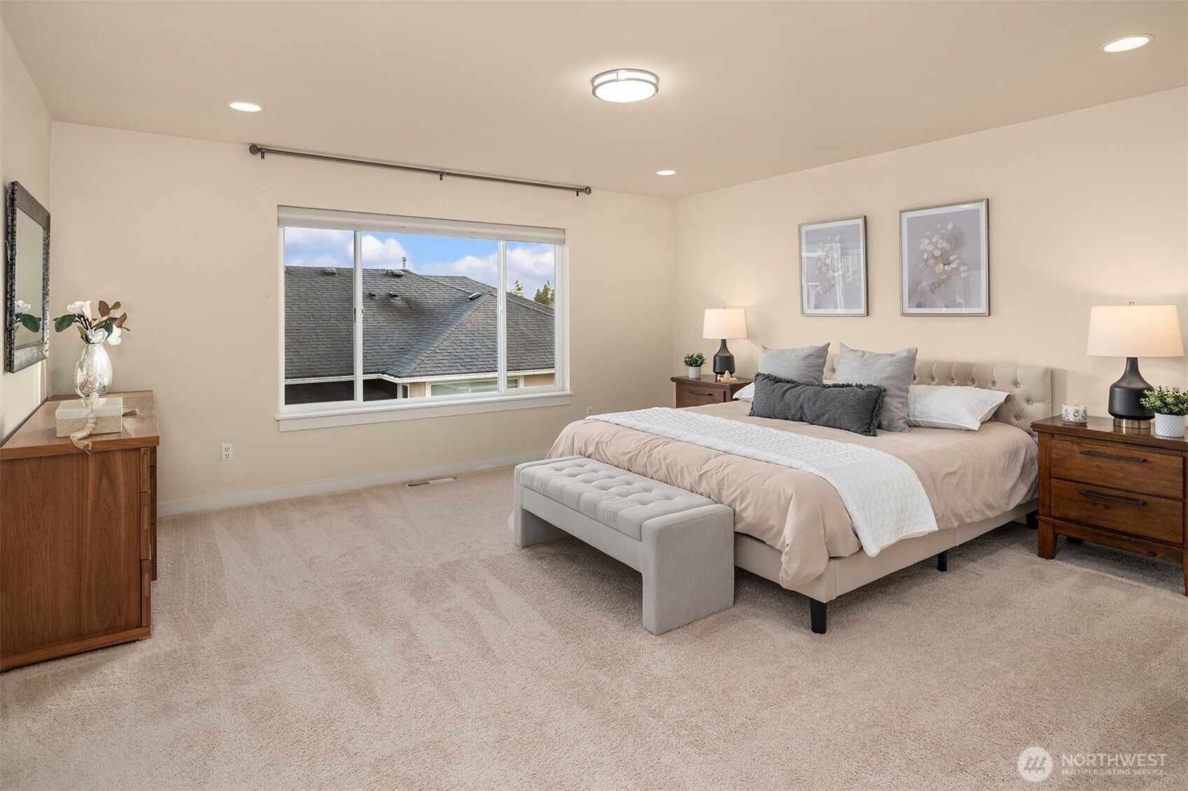 4106 167th Place Southeast Bothell, WA 98012 - Photo 27 of 35 a spacious bedroom with a bed and a large window