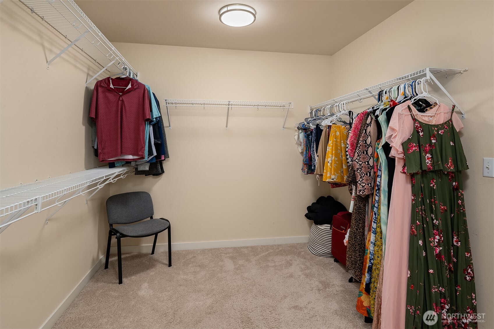 4106 167th Place Southeast Bothell, WA 98012 - Photo 29 of 35 a view of walk in closet with clothes and shoes