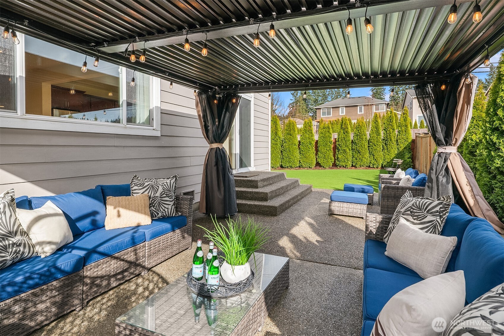 4106 167th Place Southeast Bothell, WA 98012 - Photo 3 of 35 a backyard of a house with seating space