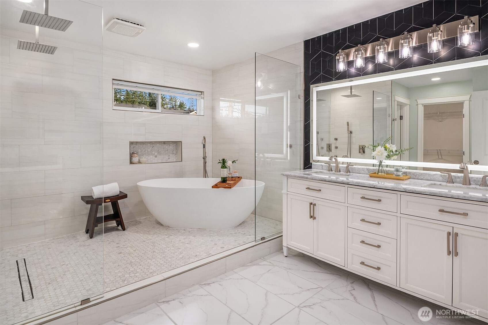 4106 167th Place Southeast Bothell, WA 98012 - Photo 4 of 35 a spacious bathroom with a double vanity sink mirror and bathtub