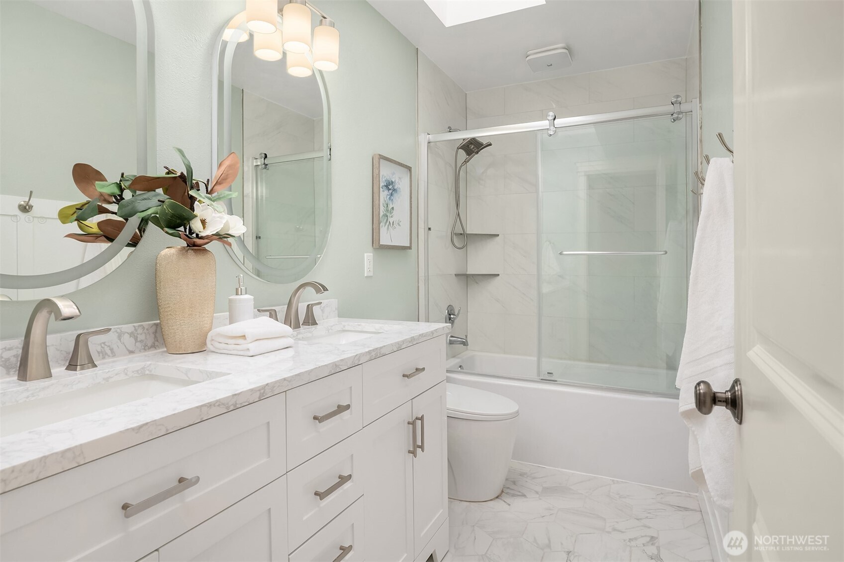 4106 167th Place Southeast Bothell, WA 98012 - Photo 7 of 35 a bathroom with a double vanity sink toilet mirror and shower