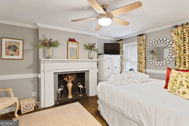 a bedroom with a bed and a fireplace