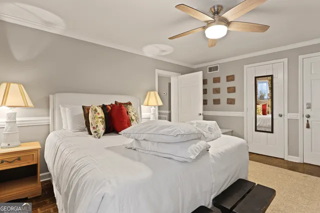 a bedroom with a large bed and a window