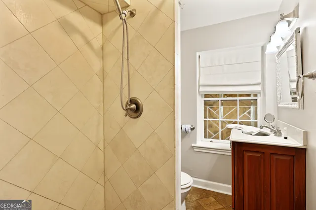 a bathroom with a sink a mirror and a shower