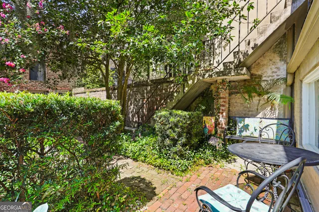 a backyard of a house with outdoor seating