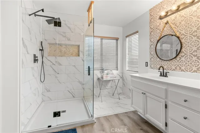 a bathroom with a sink toilet and shower