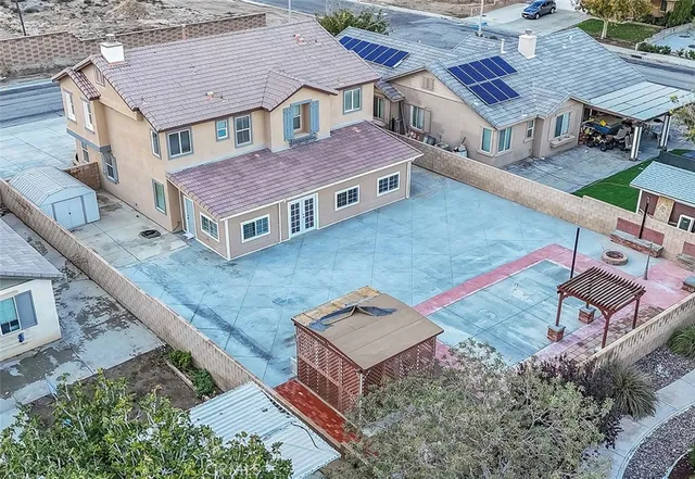 an aerial view of a house with a yard