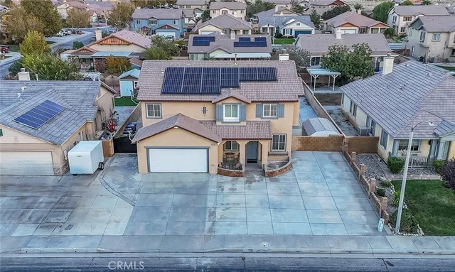 a view of a livingroom with furniture and a window