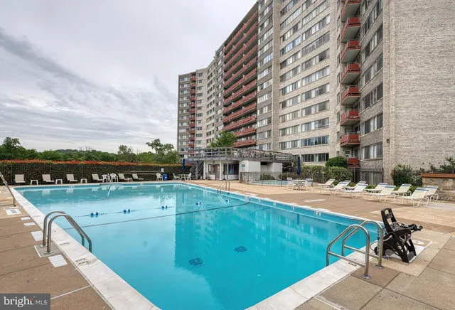 a view of a swimming pool with a terrace