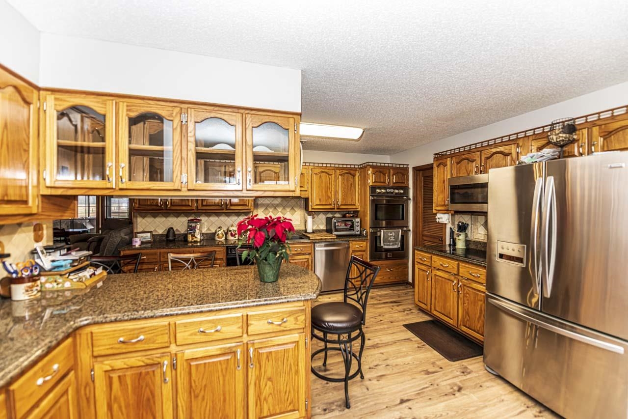 3899 Kerr Road Millington, TN 38053 - Photo 12 of 25 a kitchen with a refrigerator and a sink