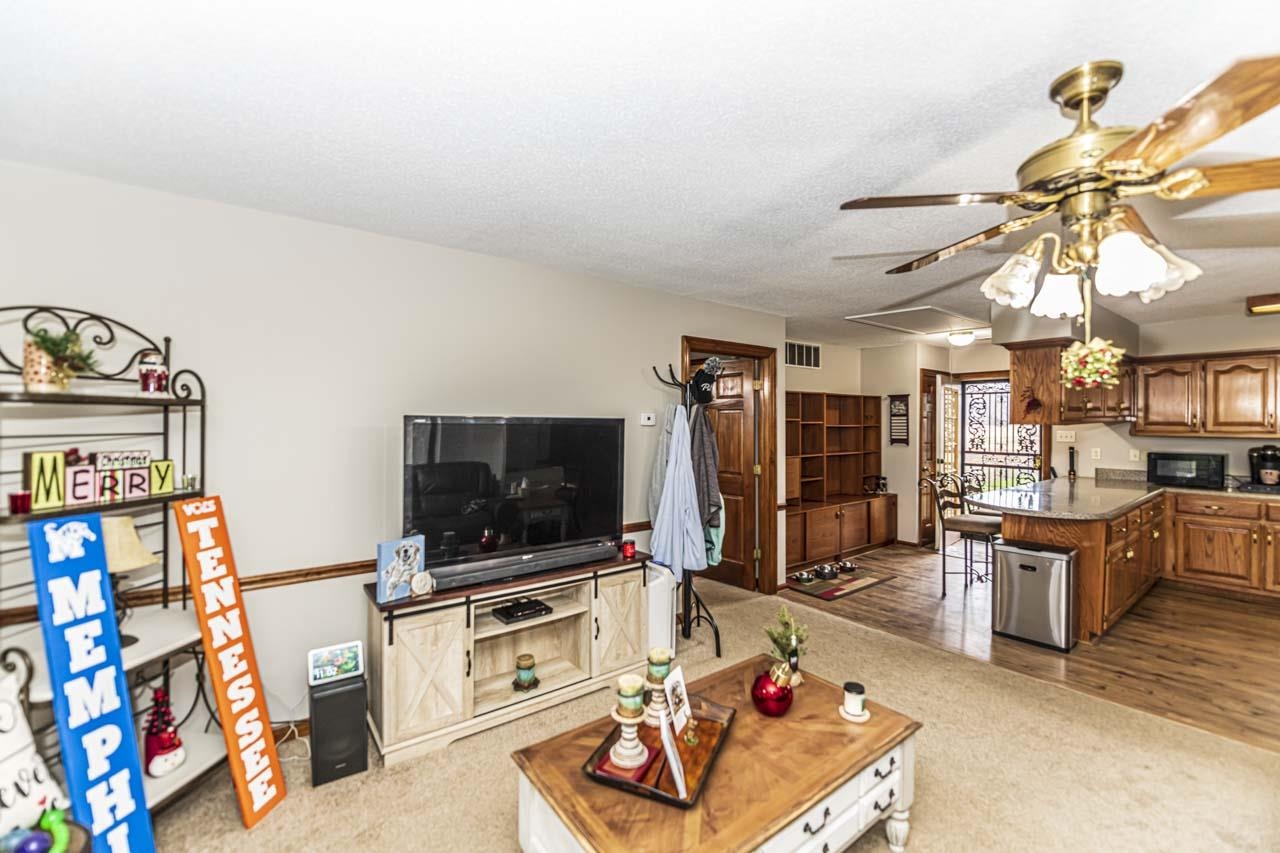 3899 Kerr Road Millington, TN 38053 - Photo 20 of 25 a living room with furniture and a flat screen tv