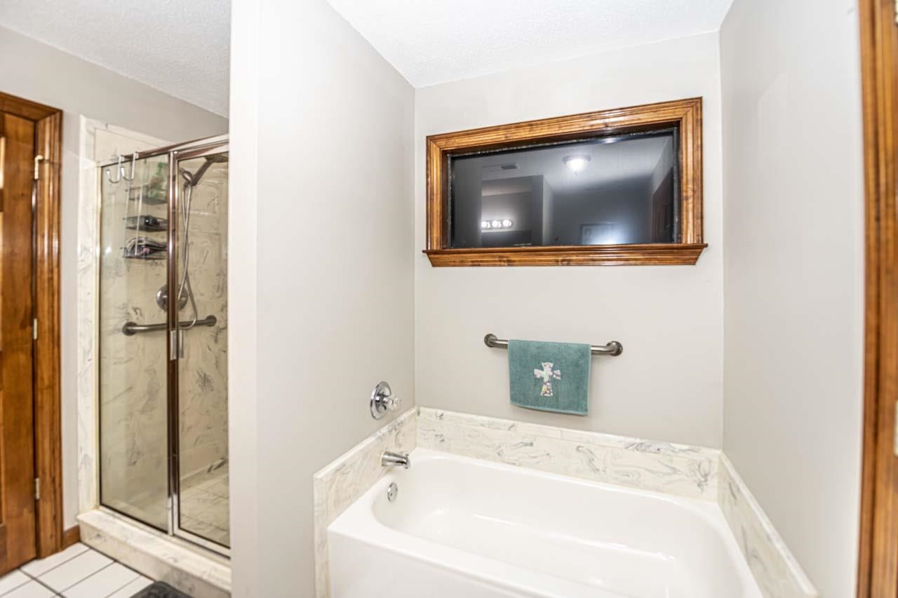 3899 Kerr Road Millington, TN 38053 - Photo 24 of 25 a bathroom with a sink and mirror with bathtub